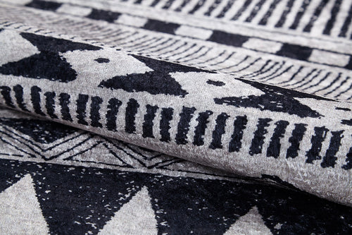Load image 1 in gallery view. Close-up of the Bohemian Sunrise - Washable Rug - JR1713 (Custom Size), showcasing its bold black and white geometric patterns—triangles, lines, and dots—perfect for adding texture and style to high-traffic areas.