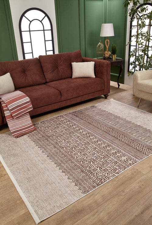 Load image 1 in gallery view. A cozy living room with a brown sofa, striped cushions and throw, the Bohemian Treasure - Washable Rug - JR1586 (Custom Size) ideal for high-traffic areas, a side table with lamp and decor, green paneled walls, arched windows, and a beige armchair.