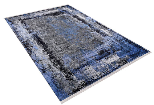 Load image 1 in gallery view. Bold and Minimalist - Washable Rug - JR1229 (Custom Size) is a rectangular rug featuring an abstract pattern in blue, gray, black, and white with a faded look. Shown at an angle against a white background; ideal for high-traffic areas.