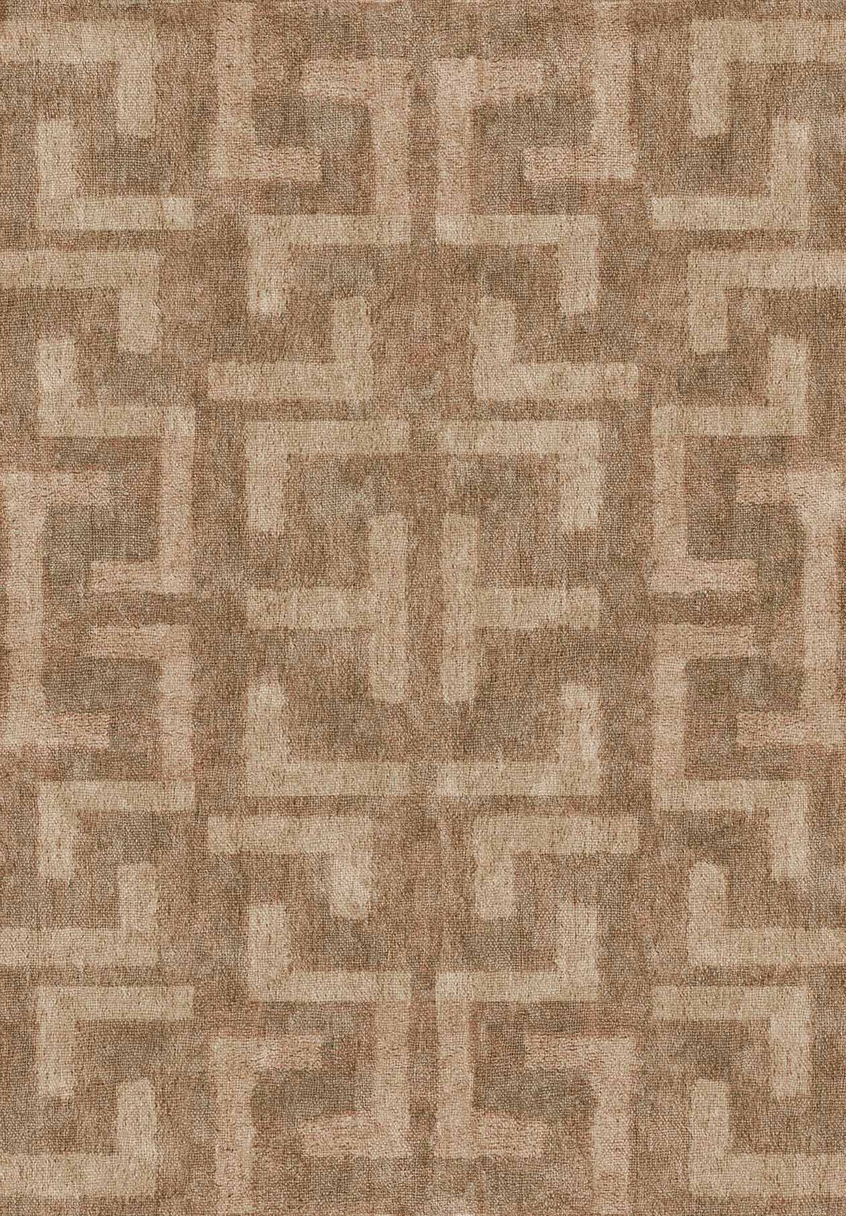 Tan and beige rug featuring a repeating geometric Greek key pattern.