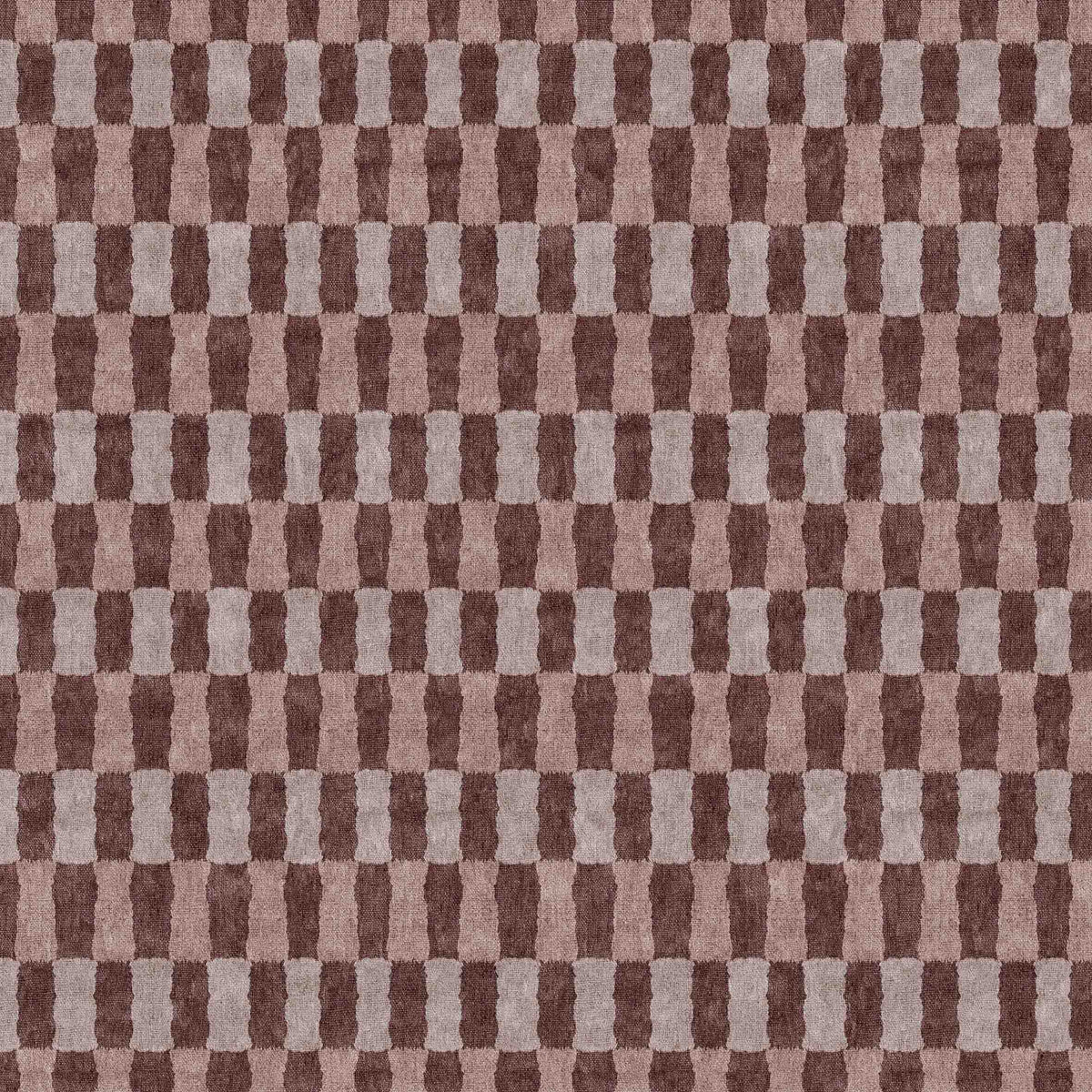 Brown and mauve rug with a repeating vertical block pattern and textured weave.