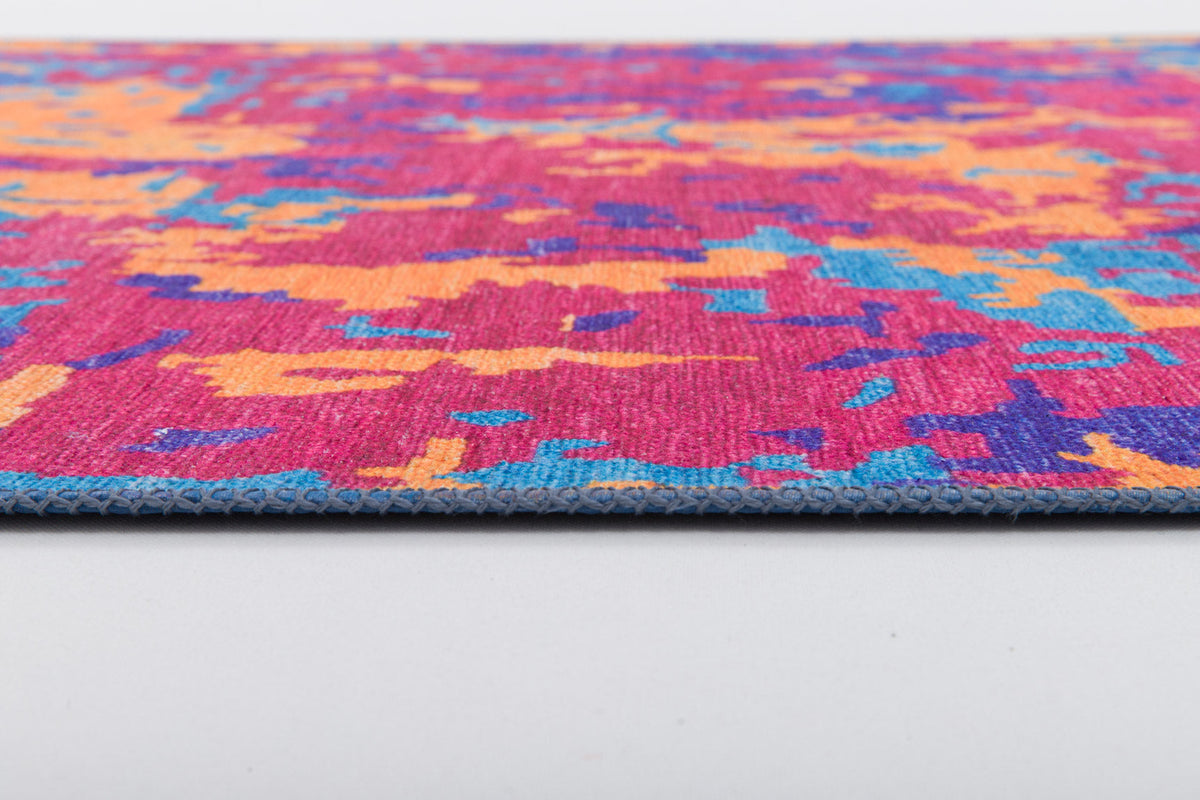A close-up of the Celestial Tapestry - Washable Rug - JRS004 (Custom Size), featuring a colorful abstract pattern in pink, orange, blue, and purple on a white background—ideal for allergy-sensitive homes and easy to clean.