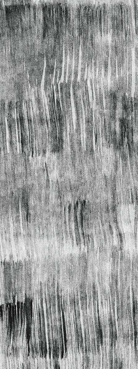 Black and white rug with a distressed, vertical brushstroke pattern and visible woven texture.