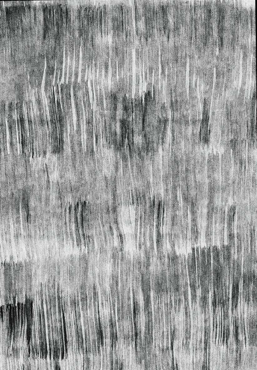 Black and white rug with a vertical, distressed brushstroke pattern and a textured, woven appearance.