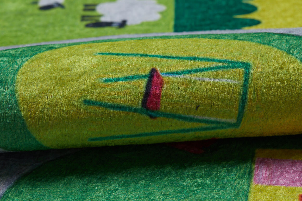 A close-up of the City Adventure - Machine-Washable Rug JRC039 (Custom Size) shows its colorful textured surface with a yellow and green background, a simple red and green chair design, and playful shapes—ideal for high-traffic areas.