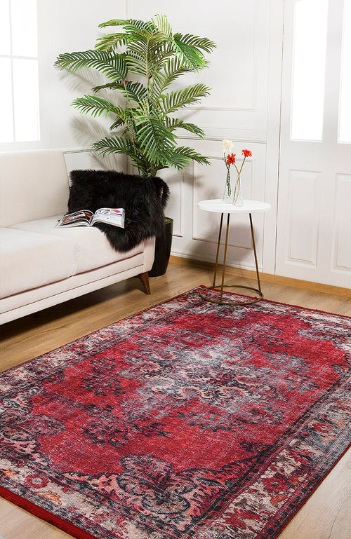 Load image 1 in gallery view. The Classic Revival - Washable Rug - JR1374 (Custom Size) adds vibrant red patterns to a bright room with wooden floors, white walls, and a white sofa—ideal for high-traffic areas and easy to keep clean.