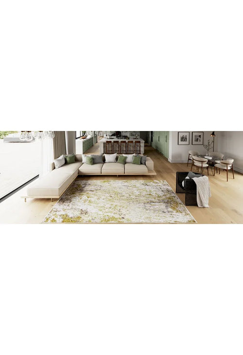 Bild 1 in Galerieansicht laden. Modern open-concept living room with light wood floors, large L-shaped sofa with green and white cushions, and the Color Splash - Washable Rug - JR146—ideal for high-traffic areas. Kitchen and dining area visible, with large windows for natural light.