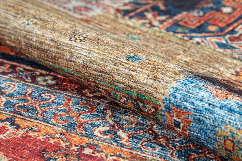 Load image 1 in gallery view. A close-up of the Colorful Composition - Washable Rug - JR5107 (Custom Size) reveals intricate blue, red, and brown designs with rich texture—ideal for adding stylish durability to high-traffic spaces.