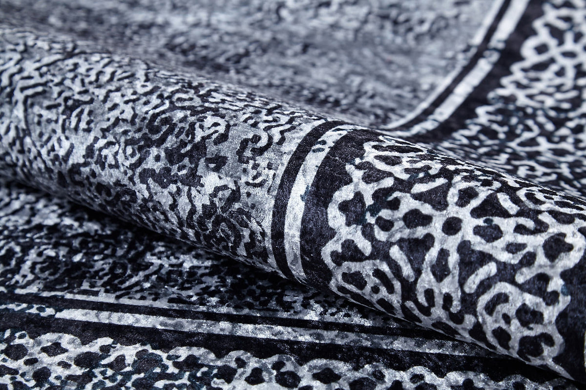 A close-up of the Contemporary Borderline - Washable Rug - JR1798 (Custom Size), featuring a black and white abstract pattern with textured details—perfect for allergy-sensitive homes or high-traffic areas.