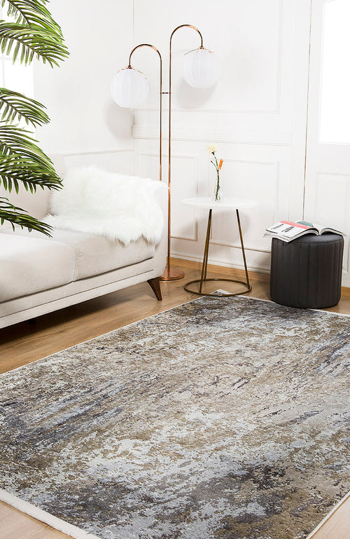 Load image 1 in gallery view. A modern living room features a light sofa, faux fur throw, round side table with vase and flower, ottoman, two-globe floor lamp, and the Contemporary Canvas - Washable Rug - JR145 (Custom Size) in yellow-gold on wooden flooring.