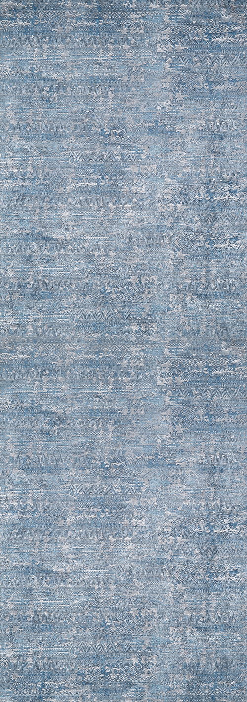 Load image 1 in gallery view. The Contemporary Serenity - Machine-Washable Rug JR1884 features a blue and gray mottled design with a textured, fabric-like look. Its soft surface and washable material make it ideal for high-traffic spaces, blending style with practical durability.