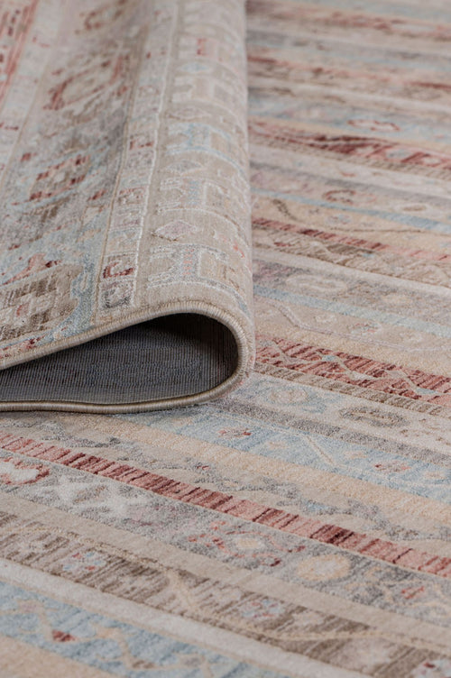 Load image 1 in gallery view. Beige, blue, and terracotta striped rug with a distressed traditional pattern, shown with a corner folded over.