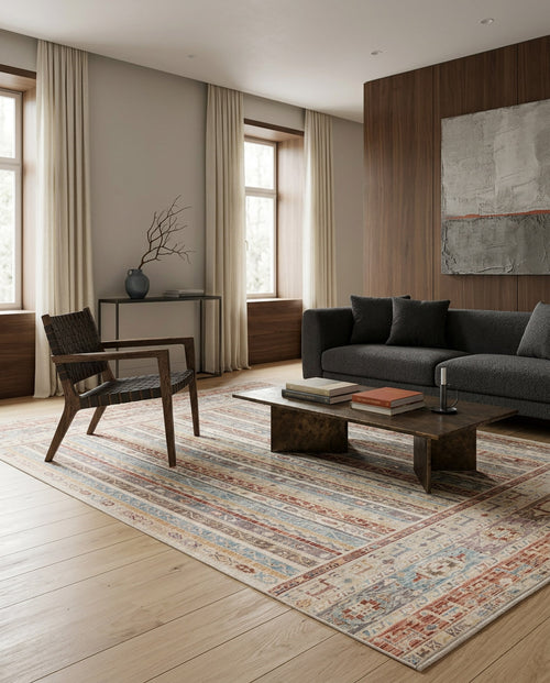 Load image 1 in gallery view. Multi-colored striped rug with a distressed traditional pattern, styled in a modern living room.