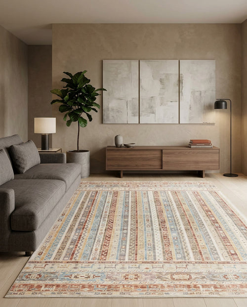 Load image 1 in gallery view. Multi-colored striped rug with distressed geometric patterns, styled in a modern living room.