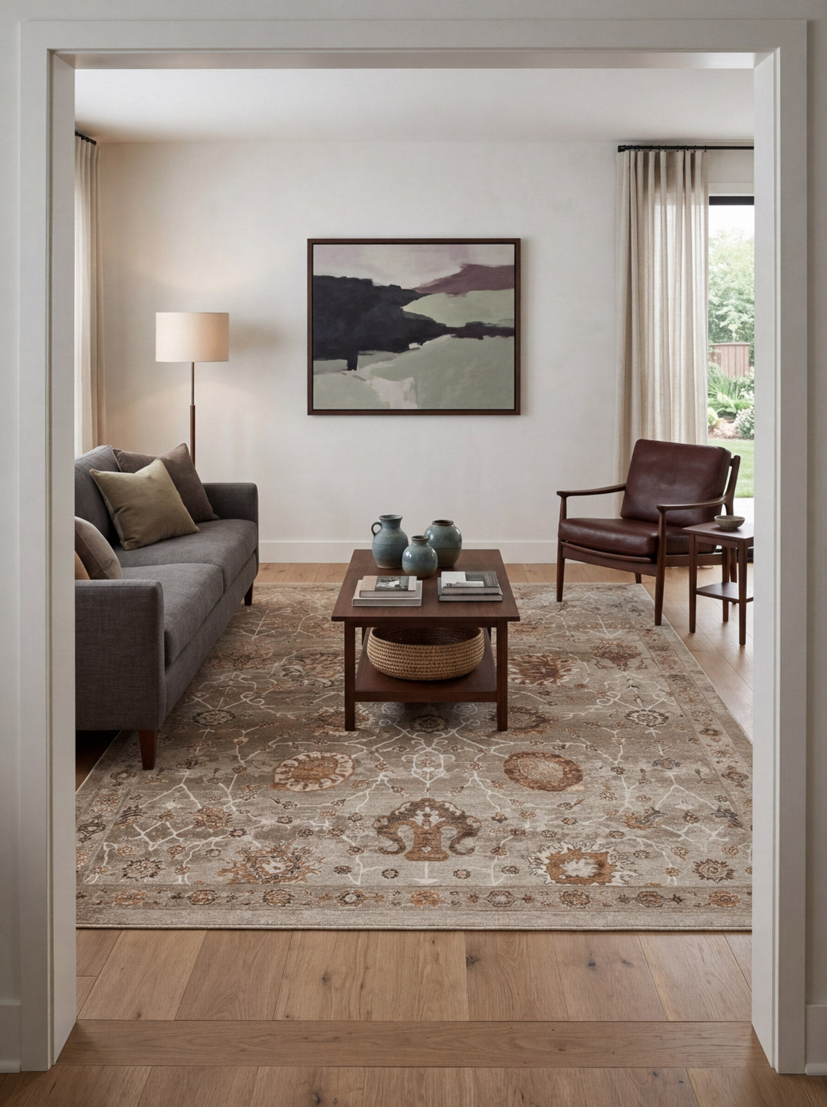 Beige and brown traditional floral medallion rug in a modern living room.