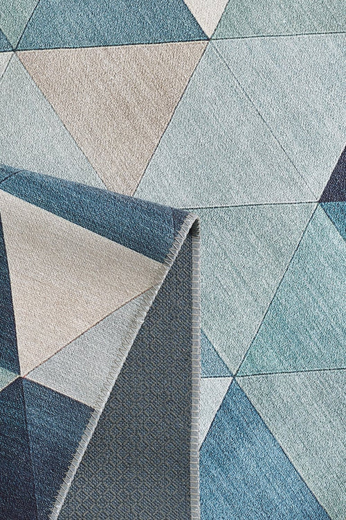 Load image 1 in gallery view. The Cubism Collage Blue Washable Rug - MDJ008 (Custom Size) features overlapping triangles and polygons in blue, gray, and beige tones with a folded corner showing the underside—perfect for high-traffic areas.