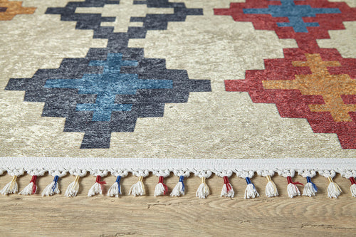 Load image 1 in gallery view. A close-up of the Desert Mirage - Washable Rug - JR5033 (Custom Size), showcasing geometric patterns in blue, black, red, and orange on a light background with a white fringe—ideal for high-traffic areas on wooden floors.
