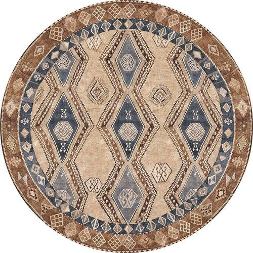 Load image 1 in gallery view. Round rug in tan, brown, and slate blue featuring a geometric diamond pattern with tribal-inspired motifs.