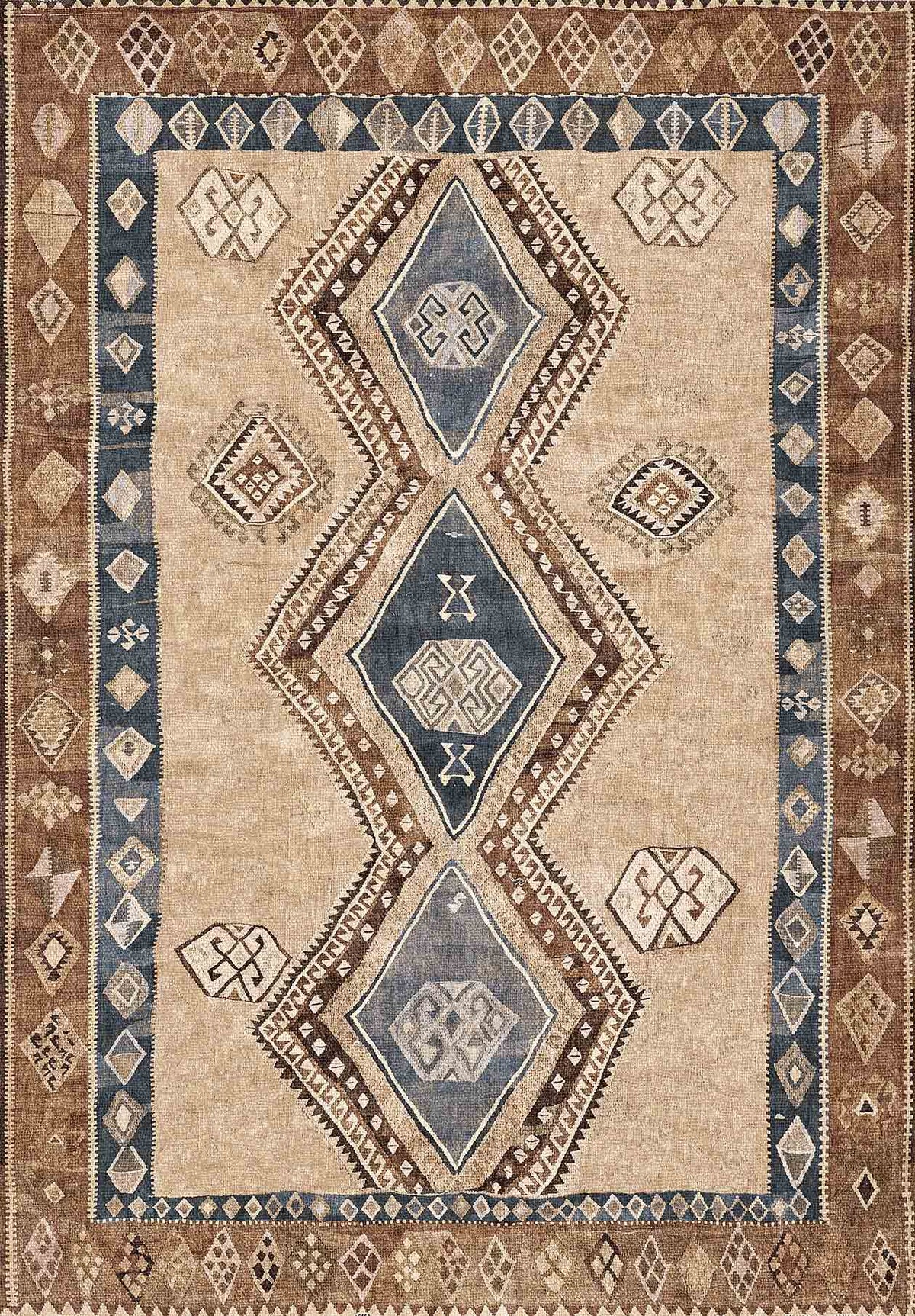 Tan, brown, and blue rug with a central column of three large diamonds and geometric border motifs.