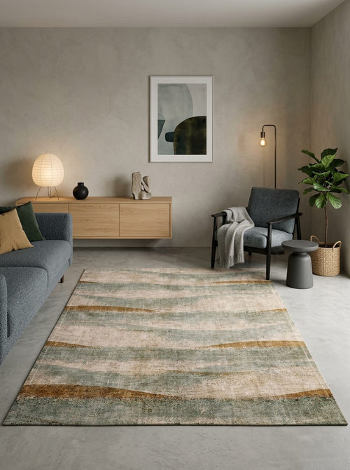 Load image 1 in gallery view. Beige, sage green, and ochre rug with a distressed horizontal wave pattern, styled in a modern living room.