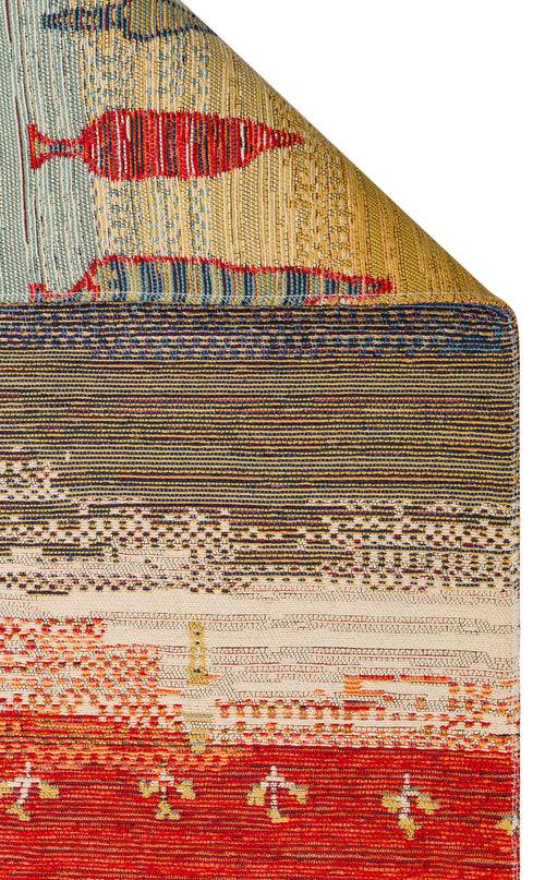 Load image 1 in gallery view. The Dust Trace - Kilim - NMD12 is a colorful modern rug with geometric patterns, fish, and abstract shapes in red, blue, yellow, and beige tones. One corner of the rug is neatly folded over.