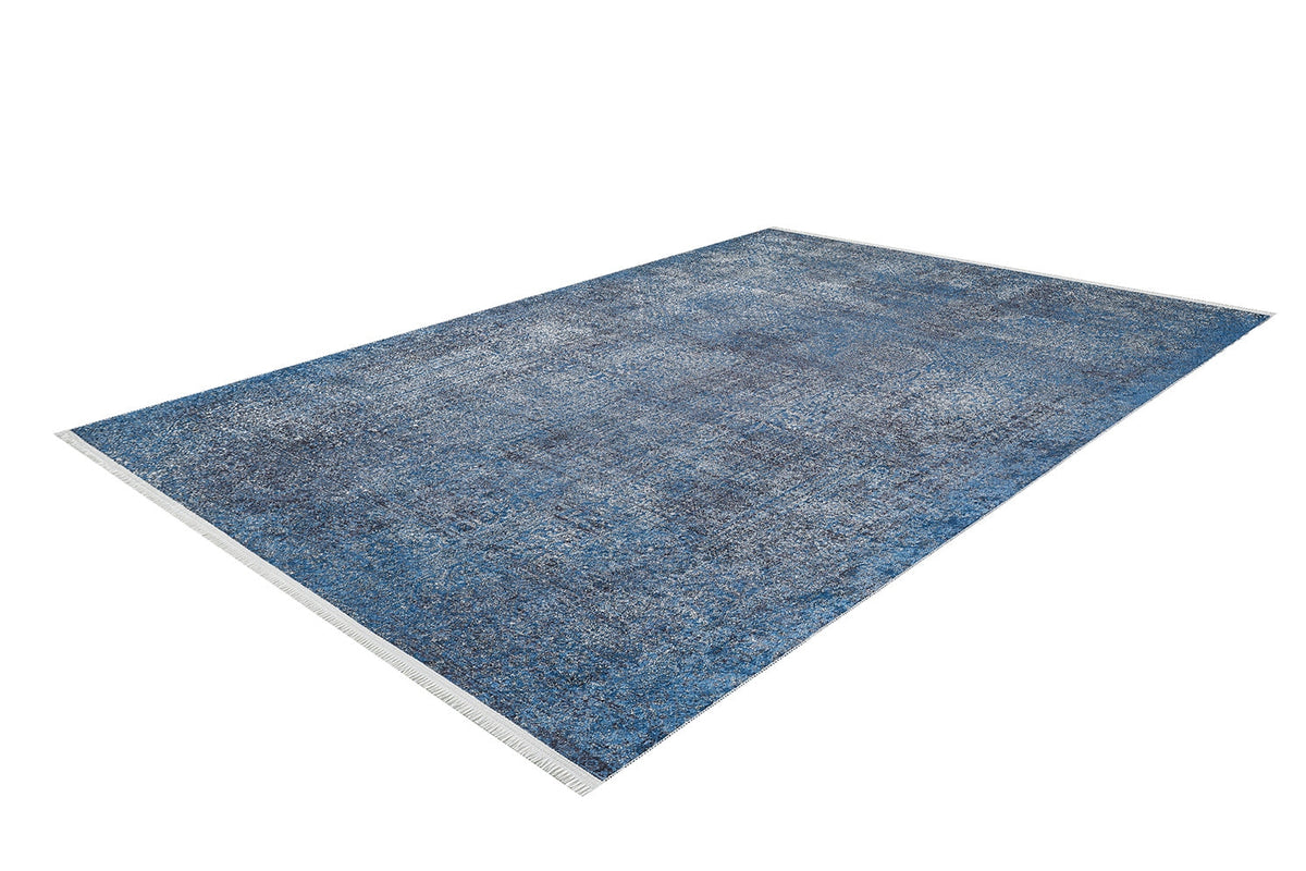 The Elegant Vine - Washable Rug - JR1847 (Custom Size) is a rectangular blue rug with a subtle distressed pattern and white fringes, ideal for high-traffic areas, shown on a white background.