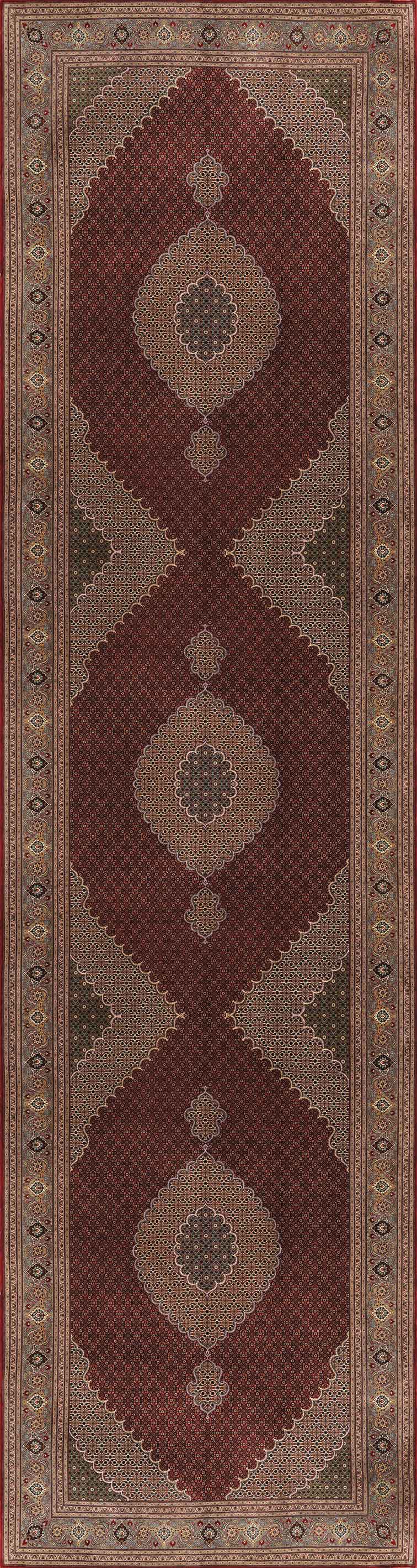 The Elysian Weave - Washable Rug (JRN1001) is a rectangular rug in rich red, showcasing geometric and diamond patterns in beige, tan, olive, and brown with multiple decorative borders in coordinating colors.