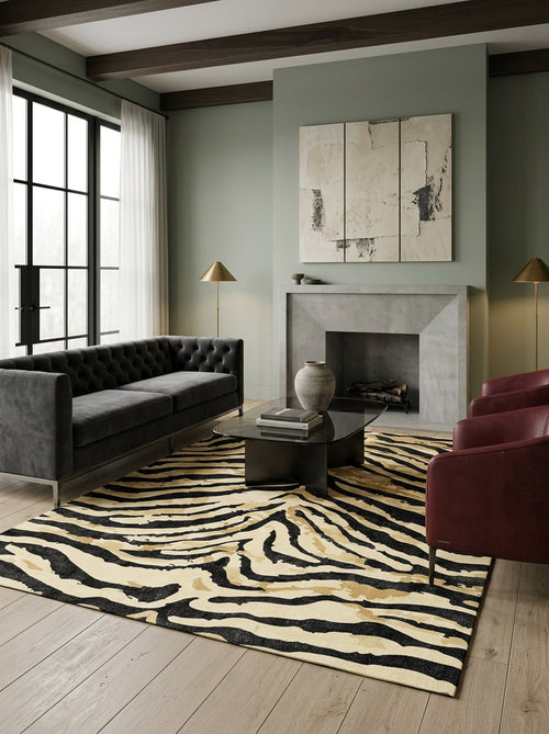 Bild 1 in Galerieansicht laden. Black, tan, and cream zebra-print rug in a modern living room with a fireplace and dark furniture.