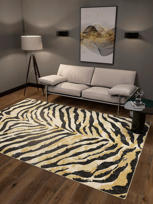 Load image 1 in gallery view. A modern living room with a beige sofa, floor lamp, abstract wall art, black side table, and the Eternal Weave - Washable Rug - JRN39 (Custom Size) in zebra stripes—stylish and ideal for high-traffic areas.