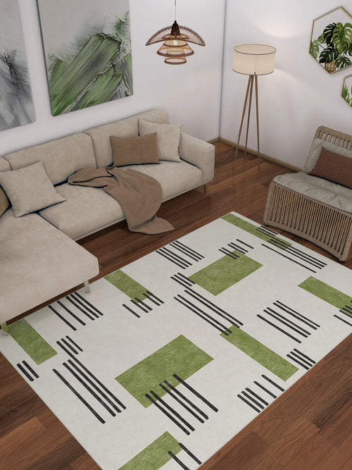 Bild 1 in Galerieansicht laden. A modern living room featuring a beige sectional sofa, brown throw, floor lamp, wicker chair, and the Faded Treasure - Washable Rug - JRN46 on wooden floors. Abstract wall art and a hanging light fixture complete the stylish space.