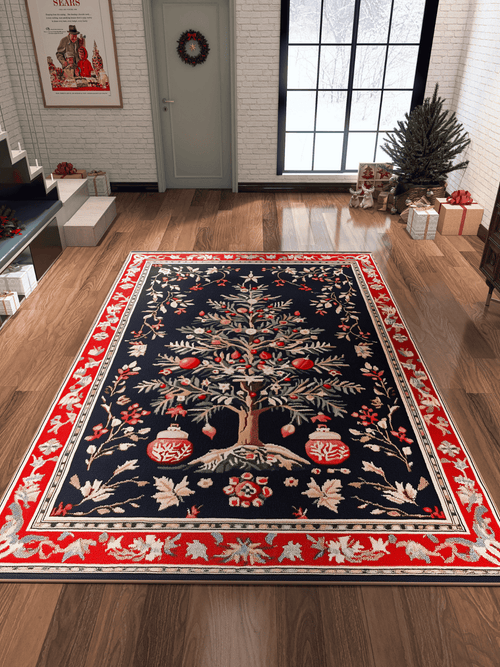 Bild 1 in Galerieansicht laden. A festive room with wood floors, decorated for Christmas with the Fir Wonderland Washable Area Rug - MDJ018 featuring trees and ornaments—ideal for high-traffic areas—a small tree, presents, a wreath on the door, and snowy windows.