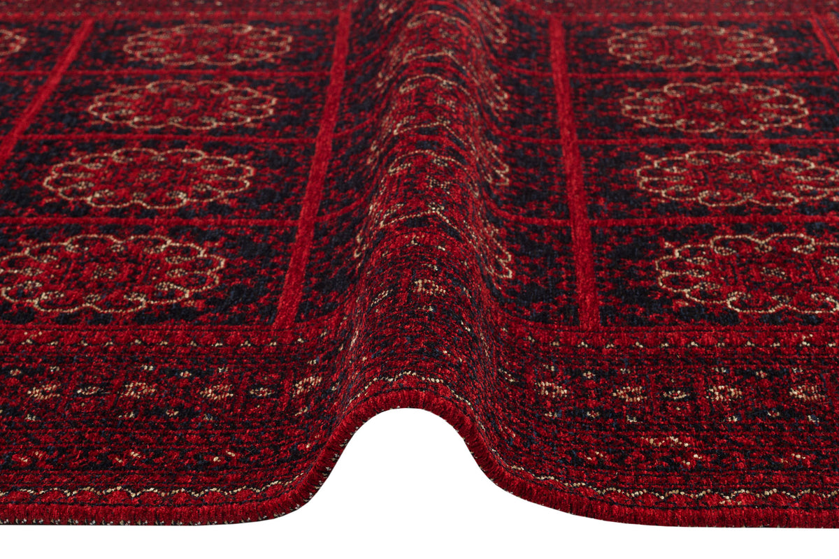 A close-up of the Fire Ripple - Kilim - BHR03 rug reveals red and dark blue patterns, a raised center fold, and intricate geometric and floral designs for elegant Turkish-inspired home decor.