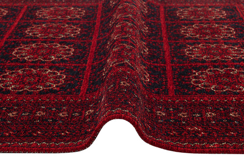 Bild 1 in Galerieansicht laden. A close-up of the Fire Ripple - Kilim - BHR03 rug reveals red and dark blue patterns, a raised center fold, and intricate geometric and floral designs for elegant Turkish-inspired home decor.