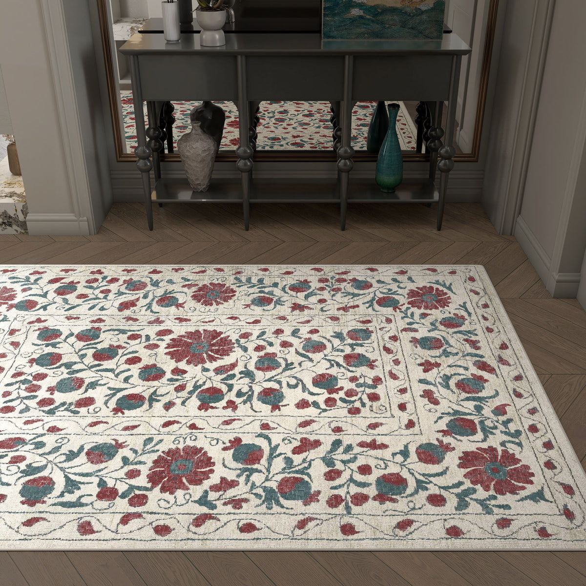 The Floral Ivory - Washable Rug - JRN1025 (Custom Size) features red and blue floral patterns on a cream background, ideal for allergy-sensitive homes or high-traffic areas, and looks stylish in front of a gray console table beneath a mirror.