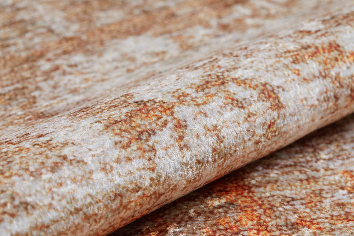 A close-up of the Fluffy Brushed - Washable Rug - JR584 (Custom Size), featuring a rolled-up, textured, mottled pattern in beige, cream, and rusty brown—ideal for high-traffic spaces.