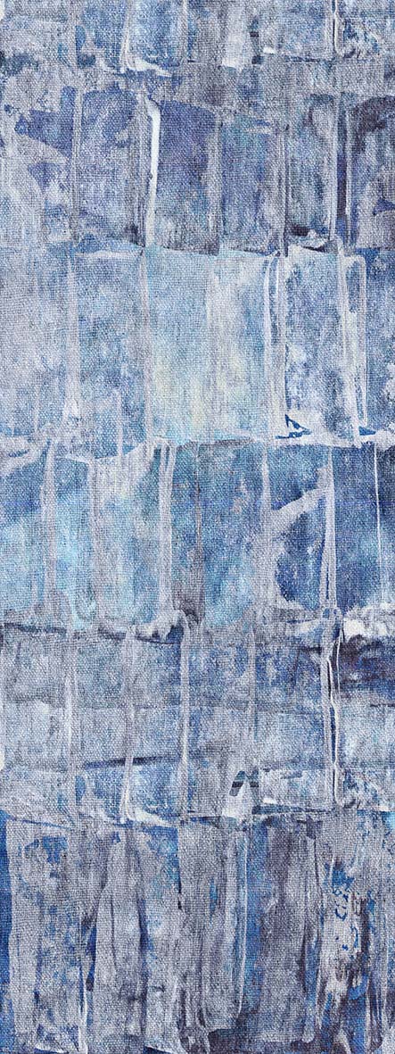 Blue and grey abstract rug with a distressed, grid-like block pattern and visible woven texture.