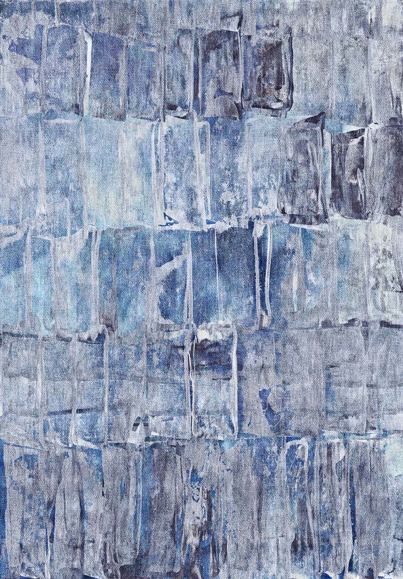 Blue and grey abstract rug with a textured, layered block pattern.