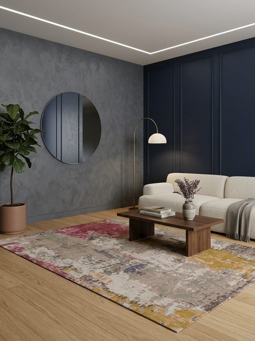 Load image 1 in gallery view. Multi-colored abstract rug with patches of magenta, gold, and grey, styled in a modern living room.