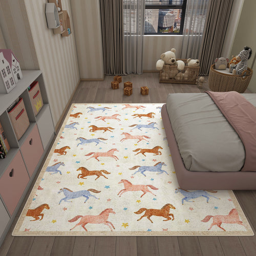 Load image 1 in gallery view. Cream rug with a repeating pattern of blue, pink, and orange horses and small stars, styled in a child's bedroom.