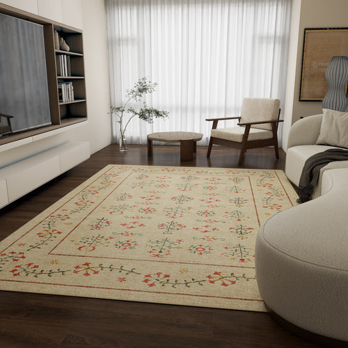 Bild 1 in Galerieansicht laden. A modern living room with dark wood floors, the Garden Cream - Washable Rug - JRN1026, a white sofa, an armchair, round wooden tables, built-in shelves, a TV, a potted plant, and sheer curtains over large windows.