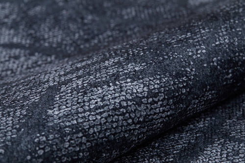 Load image 1 in gallery view. Close-up of the Geometric Gems - Washable Rug - JR1342 (Custom Size), featuring a textured, reptile-inspired black and grey pattern. This washable rug is ideal for high-traffic areas and easy to maintain.