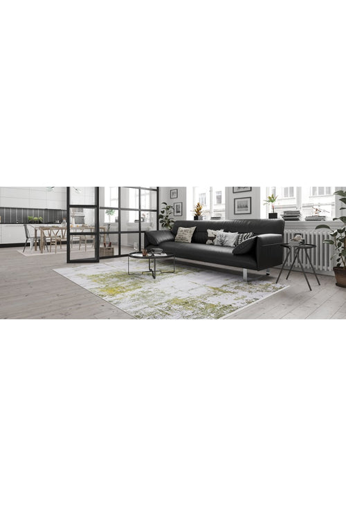 Load image 1 in gallery view. Modern living room featuring a black sofa, pillows, and the Geometric Geometry - Washable Rug - JR1290 (Custom Size), ideal for high-traffic areas. Large windows fill the space with light; dining area and kitchen visible through glass doors.
