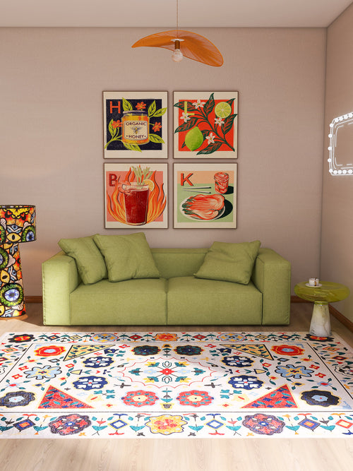 Load image 1 in gallery view. A cozy living room with a light green sofa, the Global Gathering - Washable Rug - JR608 (Custom Size) ideal for busy spaces, a small green side table, and vibrant drinks and food art prints displayed above the couch.
