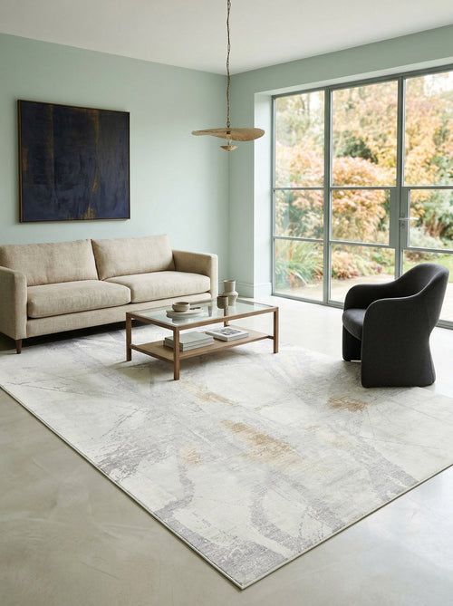 Load image 1 in gallery view. Light gray and beige abstract area rug with subtle distressed geometric lines, styled in a modern living room.