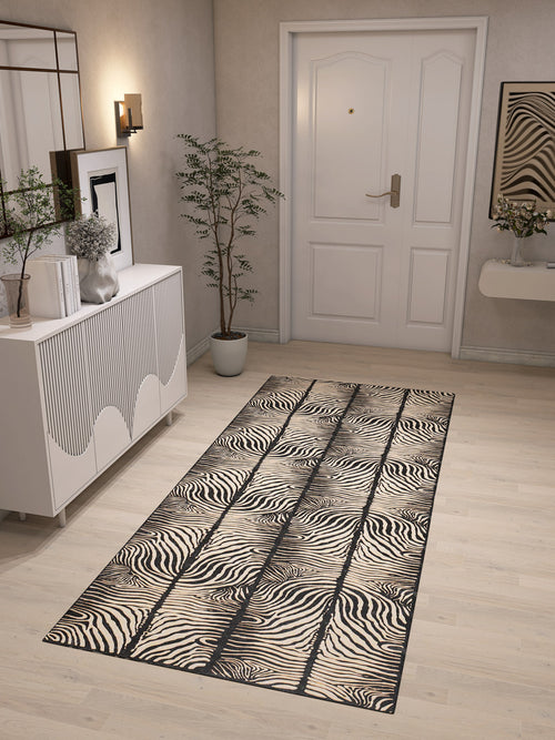 Bild 1 in Galerieansicht laden. A modern entryway with light wood floors, white walls, a white door, a potted plant, a white cabinet, wall art, and the Gossamer Fade - Washable Rug - JRN44—ideal for high-traffic and allergy-sensitive homes.