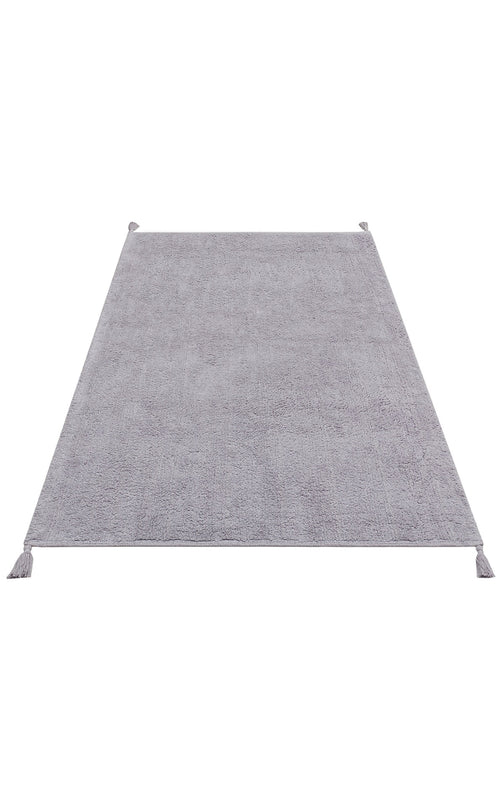 Load image 1 in gallery view. The Grey Snug - Washable Shaggy - CBNPLAIN is a rectangular, light gray cotton rug with a soft texture and tassels at each corner, ideal for modern bedrooms. Displayed on a white background.