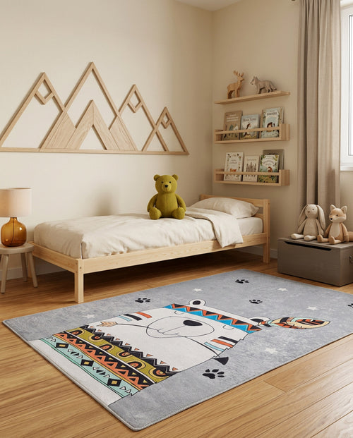 Load image 1 in gallery view. Grey rug with a stylized bear, tribal patterns, and star accents, styled in a child's bedroom.