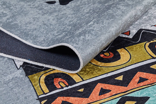 Load image 1 in gallery view. A close-up of the Groovy Bear - Machine-Washable Rug JRC093 (Custom Size) showcases its folded gray-anthracite surface with colorful geometric and abstract patterns in yellow, orange, black, and gray, highlighting its textured fabric and durable stitching.