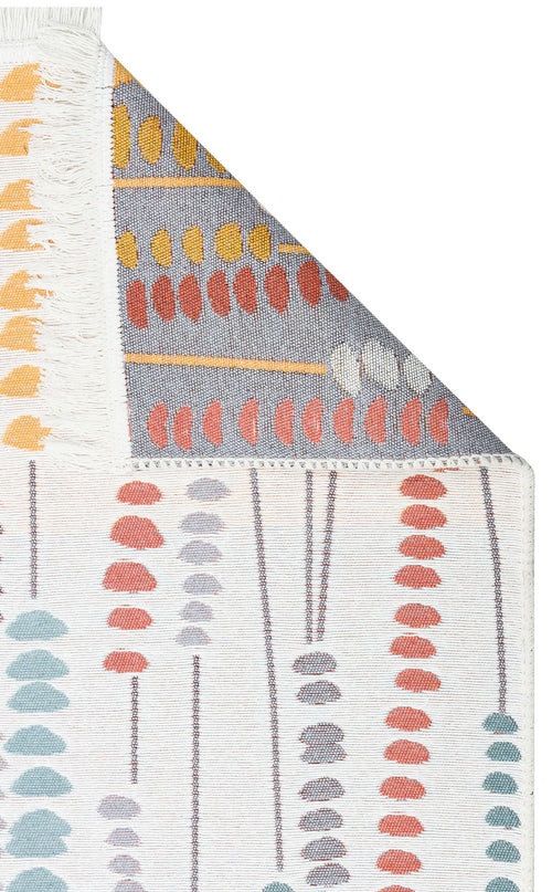Load image 1 in gallery view. A close-up of the Harmony Weave - Washable Reversible Kilims - AR34 rug shows colorful abstract leaf shapes in red, orange, yellow, and gray on a white background, with the corner folded to display its fringe edge and reversible side.