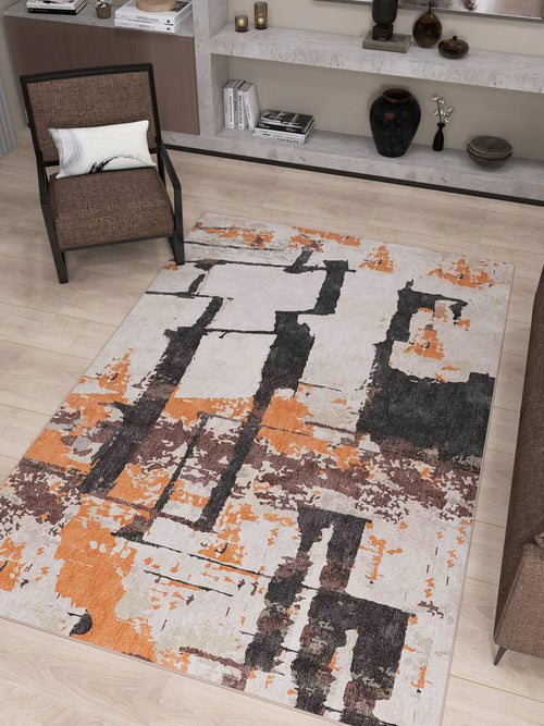 Bild 1 in Galerieansicht laden. A modern living room with the Heirloom Touch - Washable Rug - JRN42 in beige and orange on light wooden floors, paired with a brown armchair, sofa, and shelves adorned with vases, books, and ornaments—ideal for stylish modern interiors.